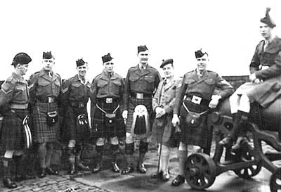 In picture of Pipe Majors Course: L/CPL George Johnston, Cameron Highlanders; CPL. Sandy Hain Black Watch; Cpl. T. Shearer, Argyll and Sutherland Highlanders; Cpl. Peter Forbes, Highland Light Infantry; P/M Bob Crabb, Scots Guards; Bobby Cuthberson; Cpl. G. Symon, Gordon Highlanders; and L/Sgt. Ramsay, Irish Guards In picture of Pipe Majors Course: L/CPL George Johnston, Cameron Highlanders; CPL. Sandy Hain Black Watch; Cpl. T. Shearer, Argyll and Sutherland Highlanders; Cpl. Peter Forbes, Highland Light Infantry; P/M Bob Crabb, Scots Guards; Bobby Cuthberson; Cpl. G. Symon, Gordon Highlanders; and L/Sgt. Ramsay, Irish Guards